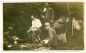 Saccani Alessandro, attendente dell'Ufficiale in camicia bianca durante una colazione sul Nad Logem, settembre 1916